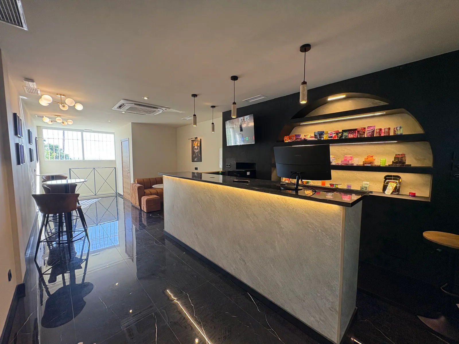 The bright room: the reception, brass ceiling lights and windows